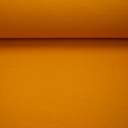 Cotton jersey, yellow gold color, 155 cm wide